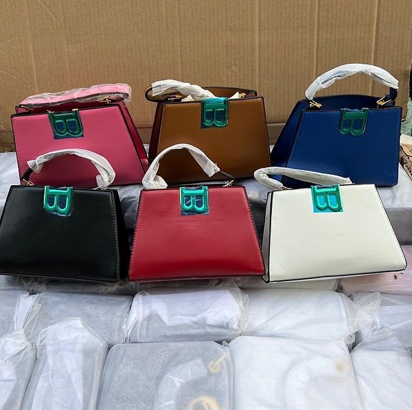 Balenciaga-inspired handbag features a distinctive metallic "B" logo hardware
