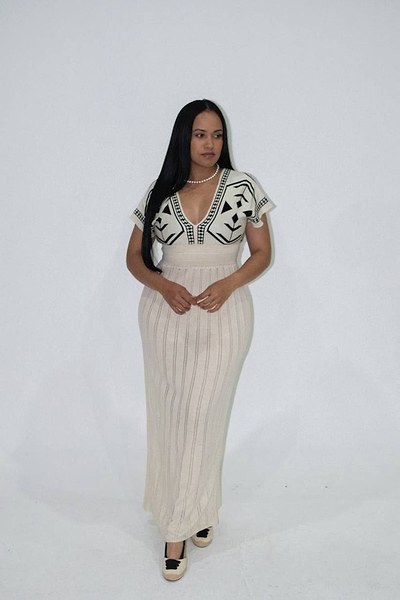 knitted V-neck dress features a white colorway and distinct black geometric pattern printing 4