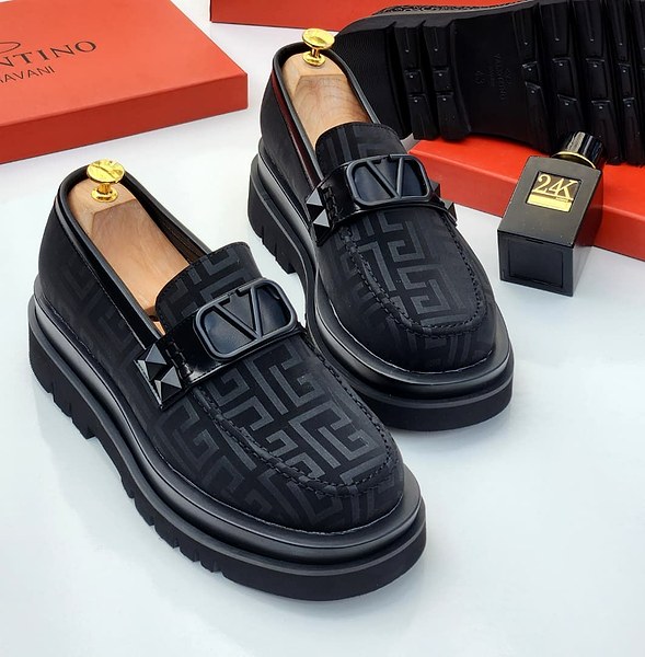 Black patterned platform loafers