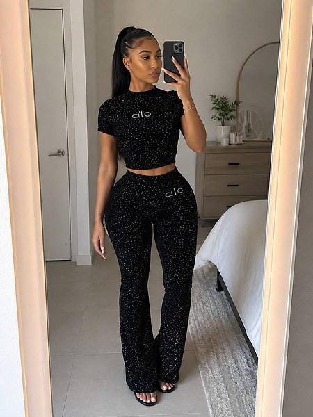 two-piece outfit featuring a glittered crop top and matching flared trousers 4