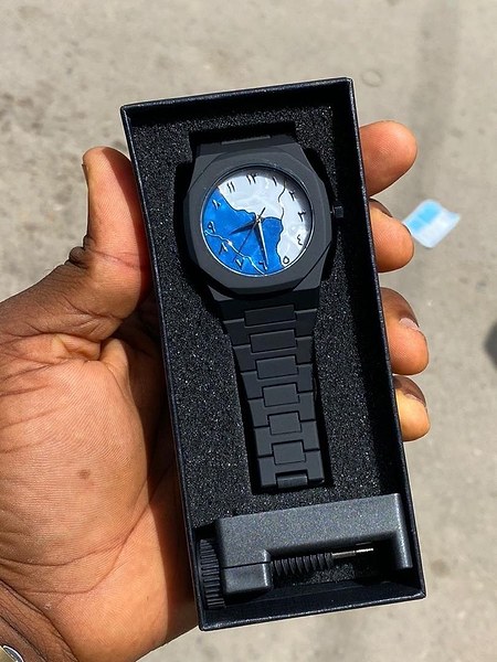 Kingcore wristwatch features a black polycarbonate strap and an octagonal case. 2