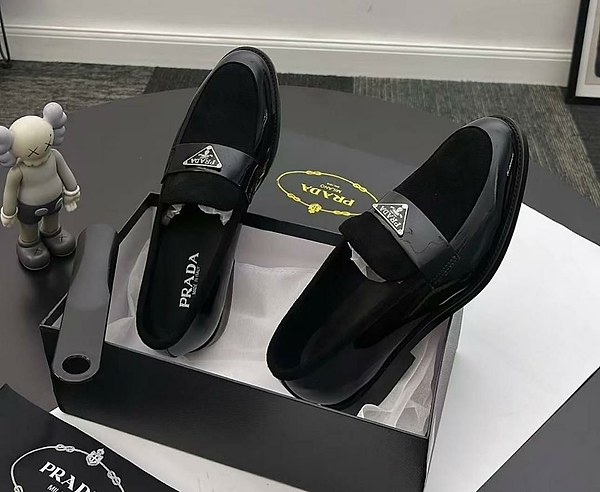 Sleek Prada men's patent leather and suede slip-on loafers